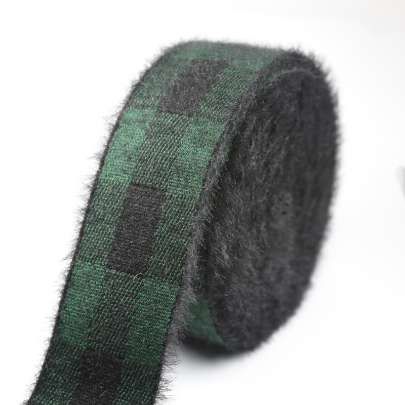 Roll of faux mink velvet plaid elastic band in green and black check, wound tightly with the fuzzy pile visible on the surface