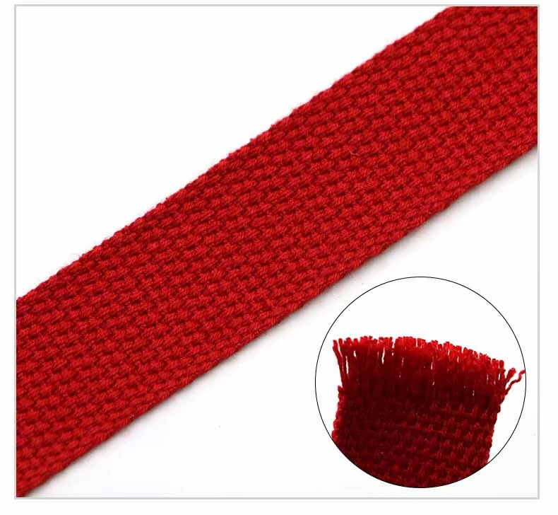 Close-up of red pearl pattern webbing showing the textured weave and cut edge