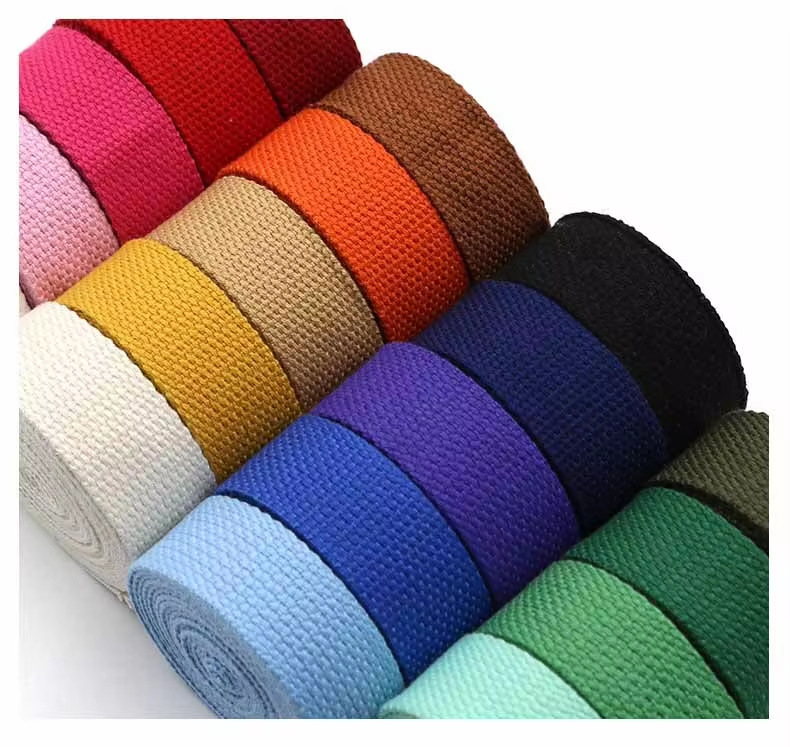 Rolls of pearl pattern polyester webbing arranged in assorted stock colors