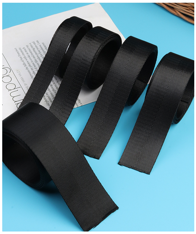 Five black herringbone webbing rolls in different widths from 2 cm to 5 cm