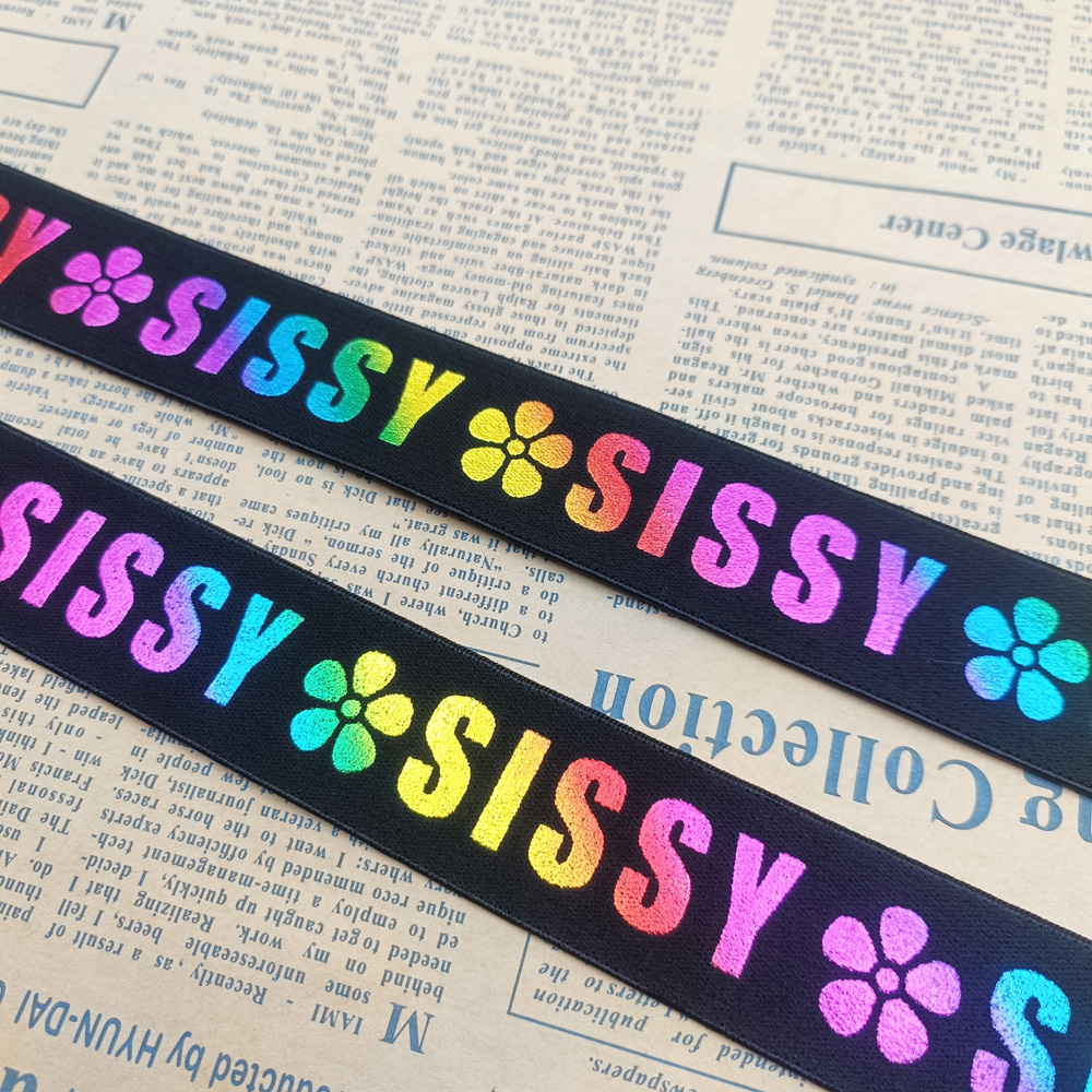 Black nylon elastic band with colorful laser print SISSY lettering and flower motifs