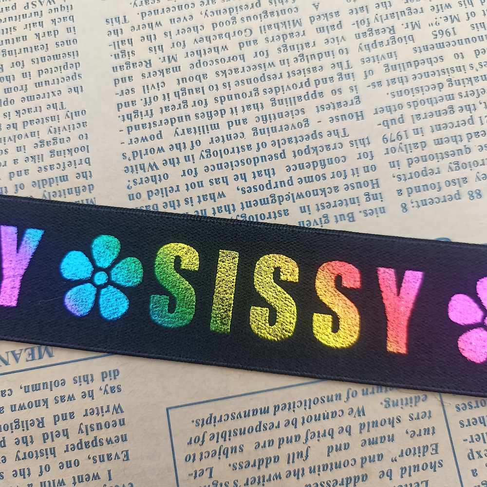Custom laser printed elastic band with floral and lettering design on black nylon